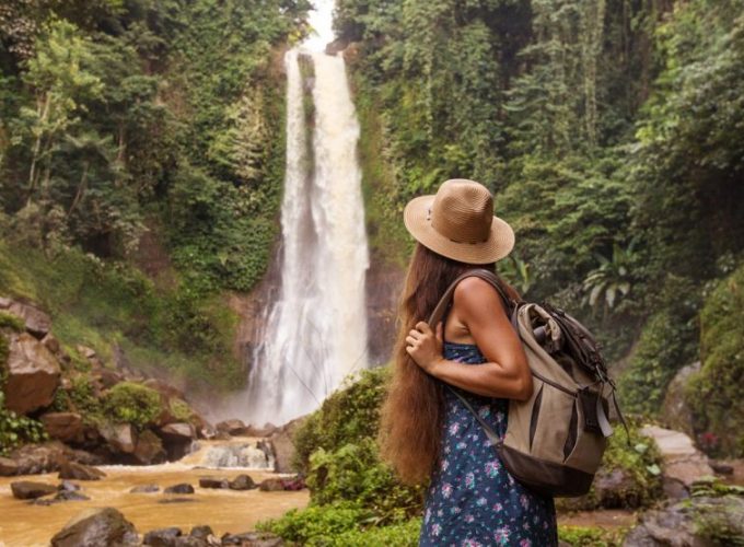 Woman at Gitgit waterfall Bali’s Pristine Northwest
